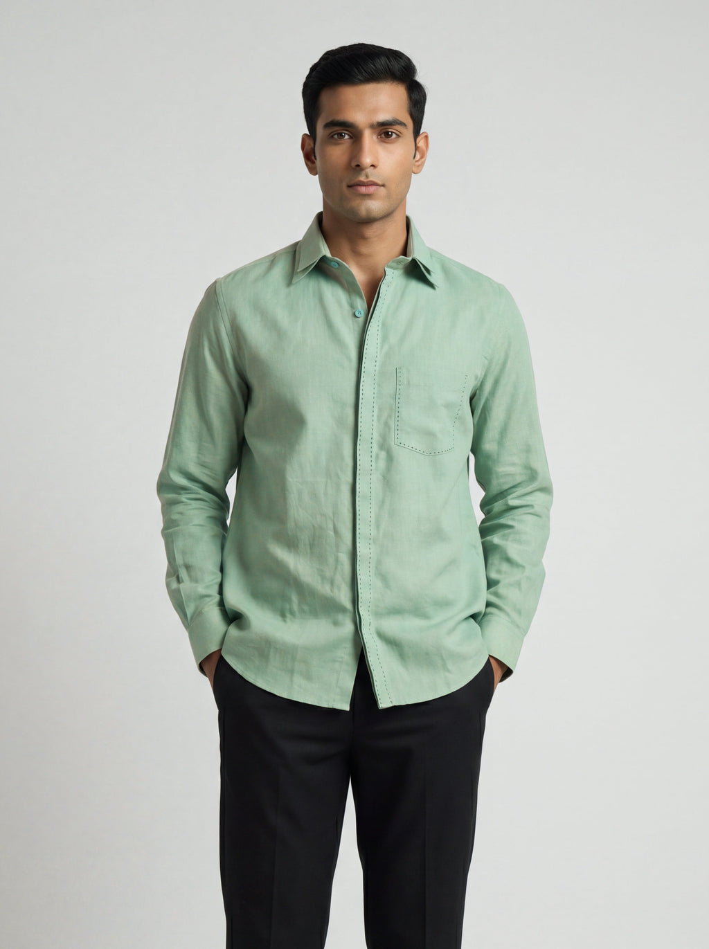 Man wearing a Sage-green Echo Shirt by BUNO paired with black pants.
